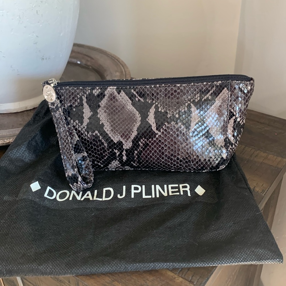Donald J Pliner  snake skin wristlet.